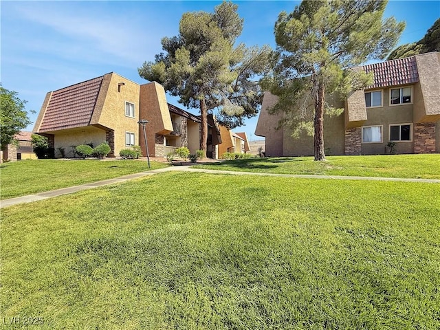 4943 Indian River Dr Unit 133, Las Vegas, NV 89103 - surrounding community with a lawn