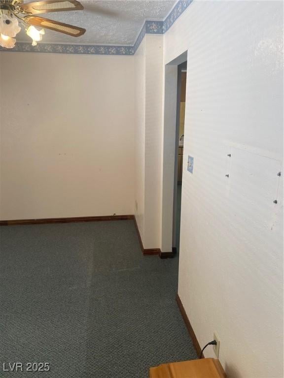 631 Mccannon St, Pioche, NV 89043 - spare room featuring ceiling fan, dark carpet, and baseboards
