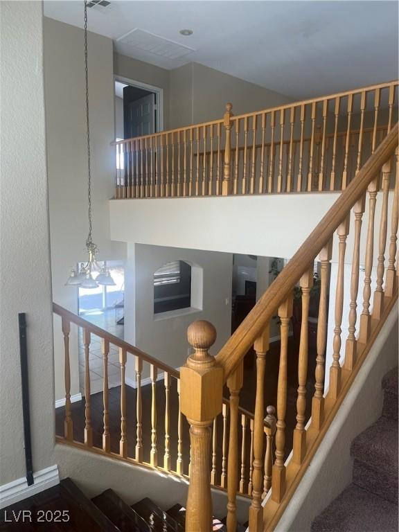 9365 Sparkling Waters Ave, Las Vegas, NV 89129 - stairs featuring a high ceiling and baseboards