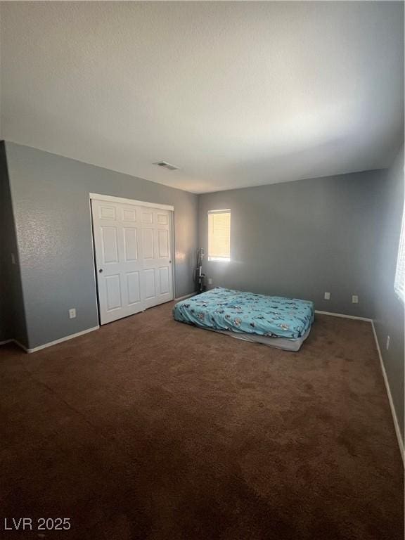 9365 Sparkling Waters Ave, Las Vegas, NV 89129 - carpeted bedroom featuring baseboards and a closet