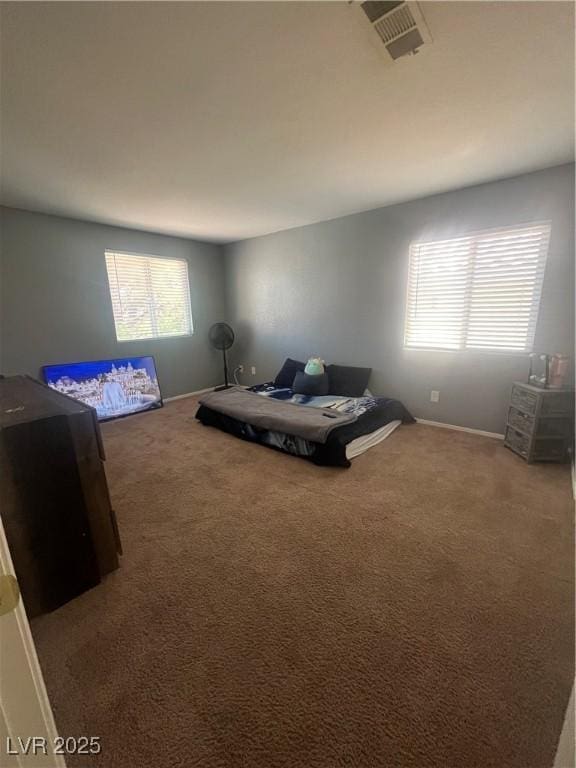9365 Sparkling Waters Ave, Las Vegas, NV 89129 - carpeted bedroom with multiple windows and baseboards