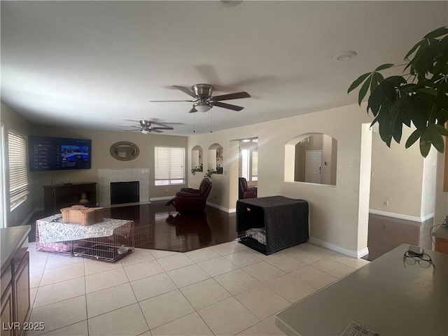 9365 Sparkling Waters Ave, Las Vegas, NV 89129 - living room featuring light tile patterned floors, ceiling fan, and baseboards