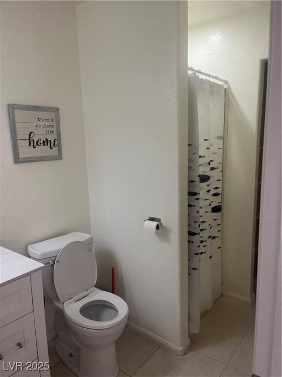 9365 Sparkling Waters Ave, Las Vegas, NV 89129 - bathroom with tile patterned flooring, toilet, vanity, and curtained shower