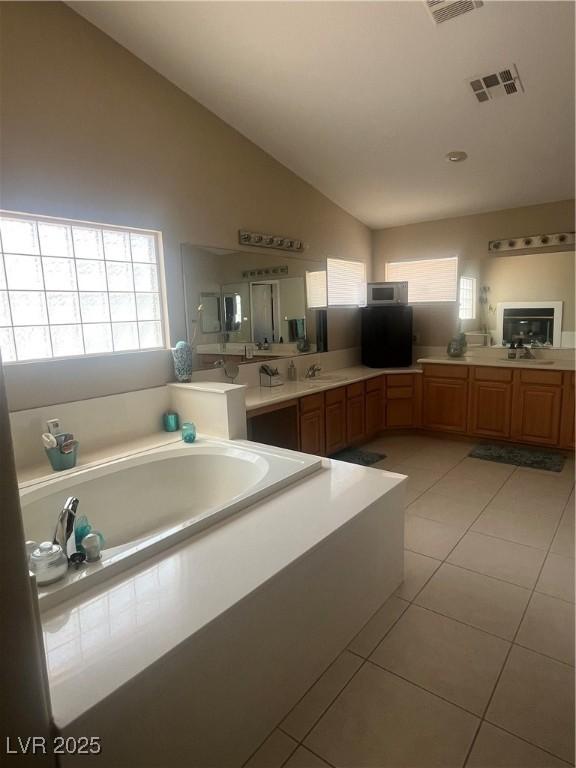 9365 Sparkling Waters Ave, Las Vegas, NV 89129 - bathroom with tile patterned flooring, a bath, plenty of natural light, vanity, and high vaulted ceiling