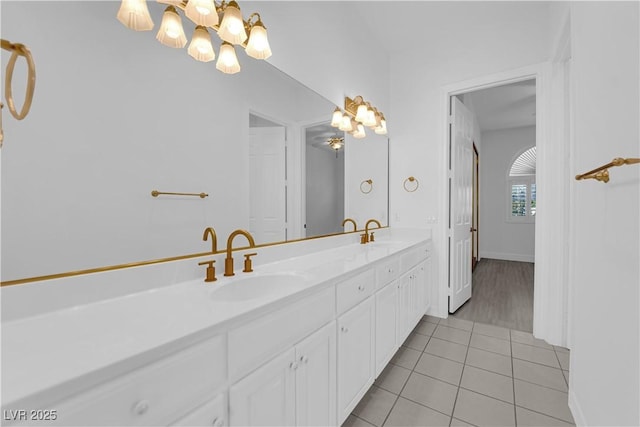 4418 Desert Bloom Ct, Las Vegas, NV 89129 - full bath with a chandelier, double vanity, and tile patterned floors