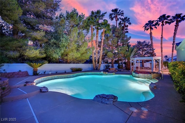 4418 Desert Bloom Ct, Las Vegas, NV 89129 - pool at dusk with a patio area and a fenced backyard
