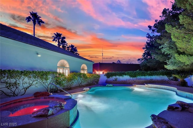 4418 Desert Bloom Ct, Las Vegas, NV 89129 - pool at dusk with a pool with connected hot tub