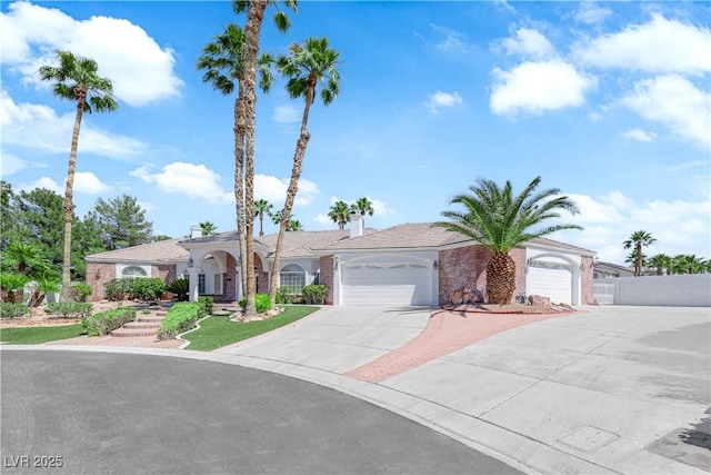 4418 Desert Bloom Ct, Las Vegas, NV 89129 - single story home with a garage, concrete driveway, and brick siding