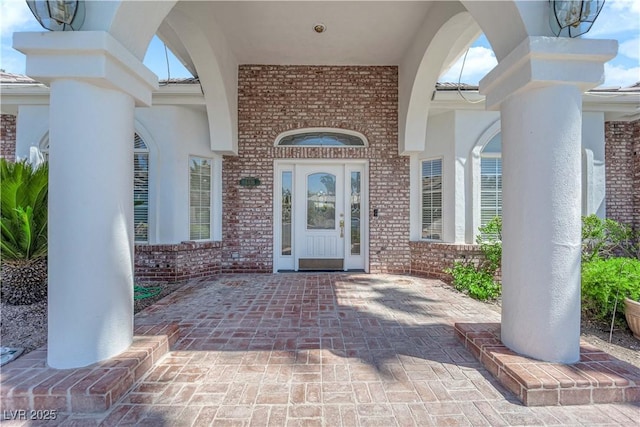 4418 Desert Bloom Ct, Las Vegas, NV 89129 - view of exterior entry featuring brick siding and stucco siding
