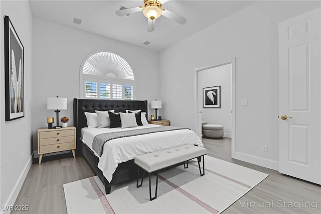 4418 Desert Bloom Ct, Las Vegas, NV 89129 - bedroom featuring light wood-type flooring, baseboards, ensuite bathroom, and ceiling fan
