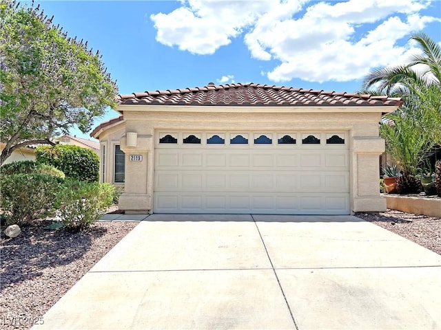 2119 Sunset Vista Ave, Henderson, NV 89052 - mediterranean / spanish home featuring a tile roof, concrete driveway, stucco siding, and a garage