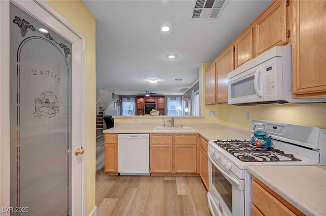 622 Quaint Acres Ave, Las Vegas, NV 89183 - kitchen featuring white appliances, a sink, light wood-style flooring, light countertops, and recessed lighting