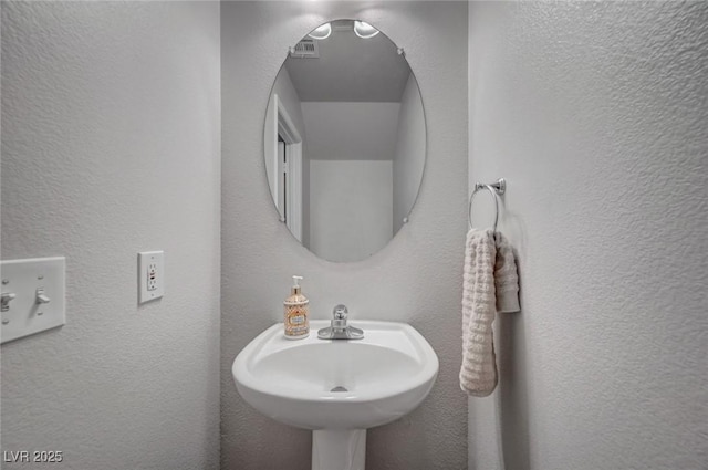 622 Quaint Acres Ave, Las Vegas, NV 89183 - bathroom featuring a sink and a textured wall