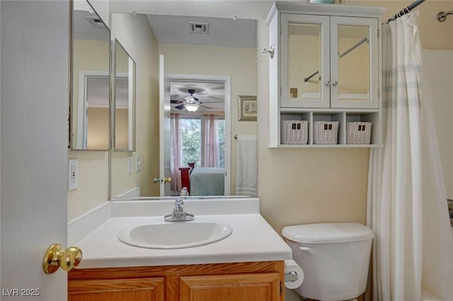 622 Quaint Acres Ave, Las Vegas, NV 89183 - full bathroom featuring vanity, toilet, a ceiling fan, and a shower with shower curtain