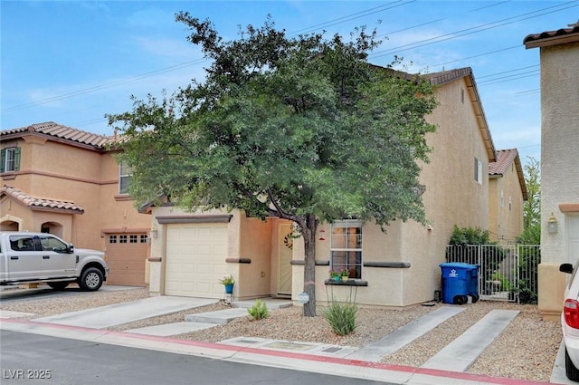 622 Quaint Acres Ave, Las Vegas, NV 89183 - view of front of property with stucco siding, driveway, and an attached garage