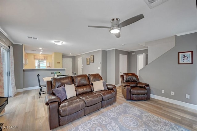 622 Quaint Acres Ave, Las Vegas, NV 89183 - living area featuring light wood-style floors, crown molding, ceiling fan, and baseboards