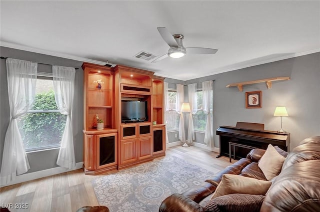 622 Quaint Acres Ave, Las Vegas, NV 89183 - living room with light wood-style floors, crown molding, a ceiling fan, and baseboards