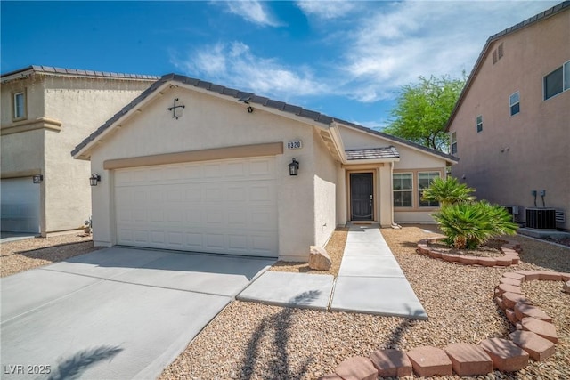 8320 Highland Ranch St, Las Vegas, NV 89131 - view of front of house featuring an attached garage, driveway, stucco siding, and central AC