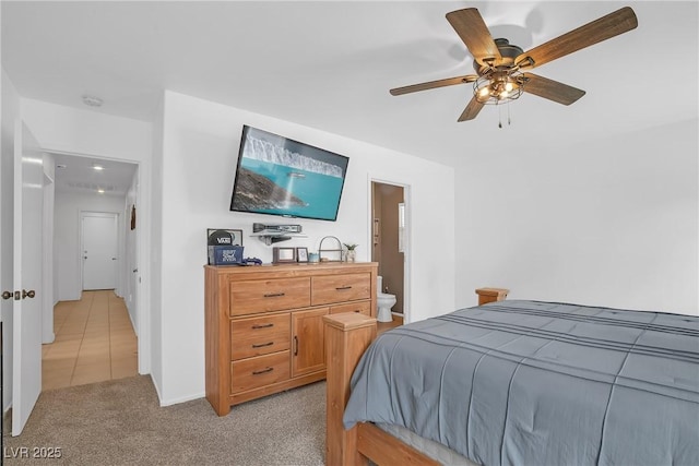 8320 Highland Ranch St, Las Vegas, NV 89131 - bedroom featuring light carpet, ceiling fan, ensuite bathroom, and light tile patterned floors