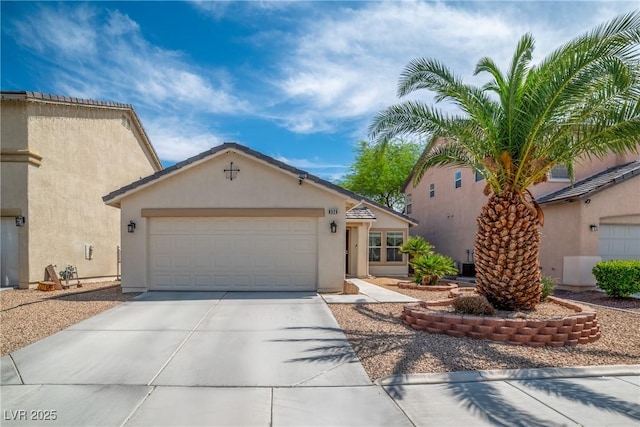 8320 Highland Ranch St, Las Vegas, NV 89131 - view of front of home with driveway, a garage, and stucco siding