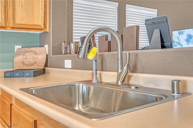 8320 Highland Ranch St, Las Vegas, NV 89131 - kitchen view of a sink, light countertops, and light brown cabinetry