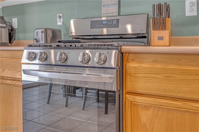 8320 Highland Ranch St, Las Vegas, NV 89131 - kitchen view of stainless steel gas range oven and light countertops