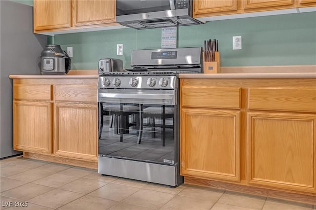 8320 Highland Ranch St, Las Vegas, NV 89131 - kitchen featuring stainless steel appliances, light tile patterned flooring, light countertops, and light brown cabinetry