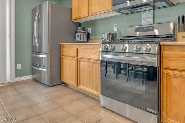 8320 Highland Ranch St, Las Vegas, NV 89131 - kitchen with appliances with stainless steel finishes, light tile patterned floors, light countertops, and baseboards