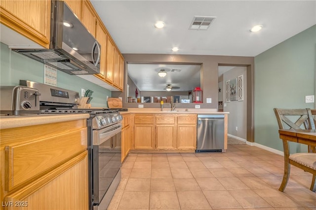8320 Highland Ranch St, Las Vegas, NV 89131 - kitchen with appliances with stainless steel finishes, light countertops, light tile patterned floors, a sink, and recessed lighting