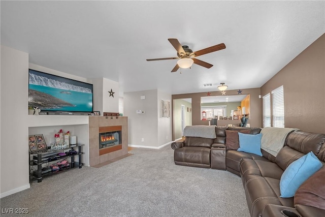 8320 Highland Ranch St, Las Vegas, NV 89131 - living area with a ceiling fan, carpet floors, a tiled fireplace, and baseboards
