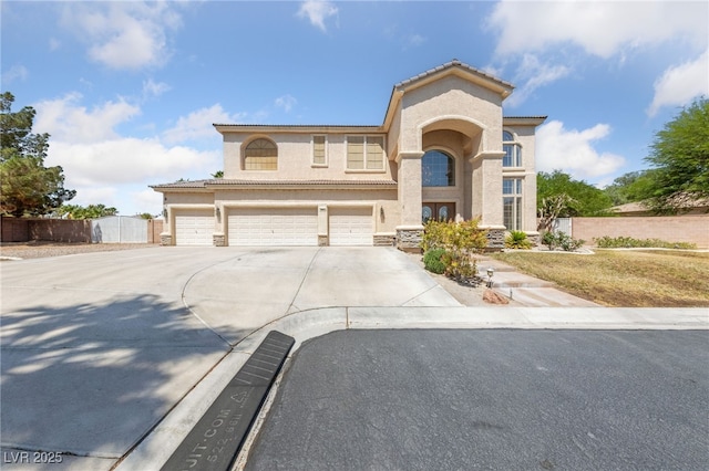 4883 Grey Mesa St, Las Vegas, NV 89149 - mediterranean / spanish-style home featuring stucco siding, driveway, and a garage