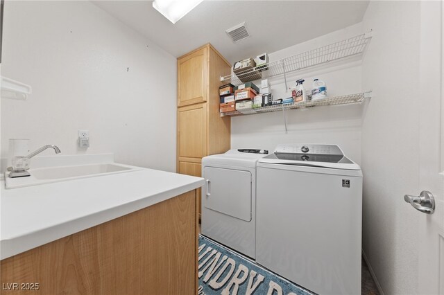 4883 Grey Mesa St, Las Vegas, NV 89149 - washroom featuring cabinet space and independent washer and dryer