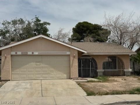 2450 Oak Glen Way, Las Vegas, NV 89115 - ranch-style home with an attached garage, concrete driveway, and stucco siding