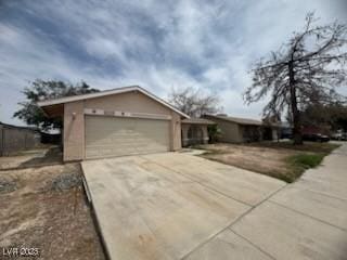 2450 Oak Glen Way, Las Vegas, NV 89115 - view of front of home with driveway and an attached garage