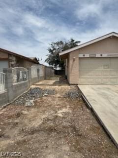 2450 Oak Glen Way, Las Vegas, NV 89115 - view of side of home featuring driveway and a garage