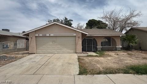 2450 Oak Glen Way, Las Vegas, NV 89115 - ranch-style house featuring a garage and concrete driveway