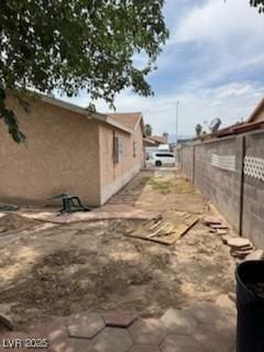 2450 Oak Glen Way, Las Vegas, NV 89115 - view of home's exterior featuring stucco siding