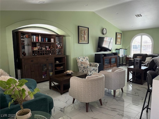 6248 Sapporo Cir, Las Vegas, NV 89110 - living room with light marble finish flooring and vaulted ceiling