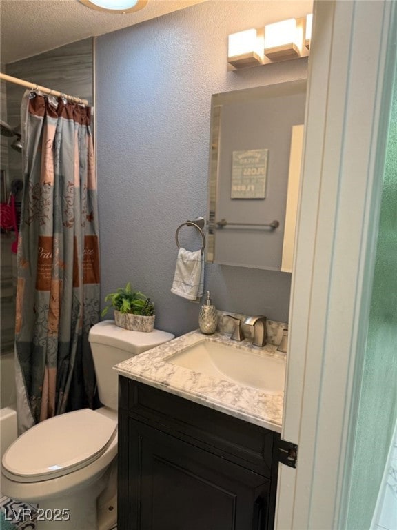 6248 Sapporo Cir, Las Vegas, NV 89110 - bathroom featuring vanity, toilet, shower / bathtub combination with curtain, a textured ceiling, and a textured wall