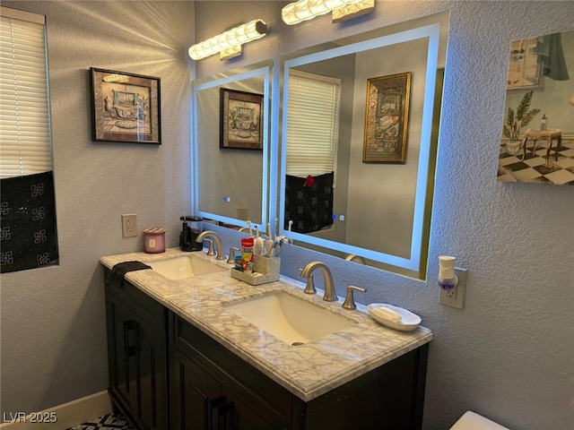 6248 Sapporo Cir, Las Vegas, NV 89110 - bathroom with double vanity and a textured wall