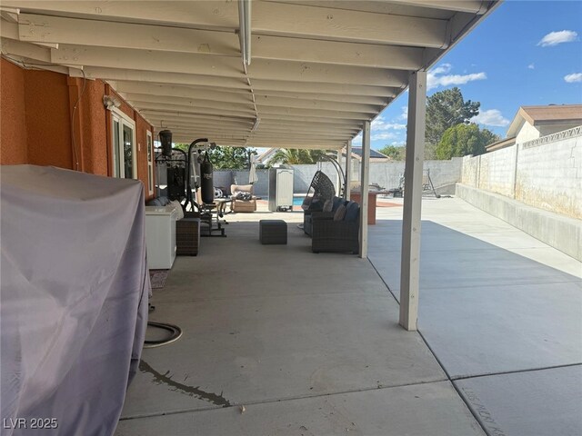 6248 Sapporo Cir, Las Vegas, NV 89110 - fenced backyard featuring outdoor lounge area and a patio area