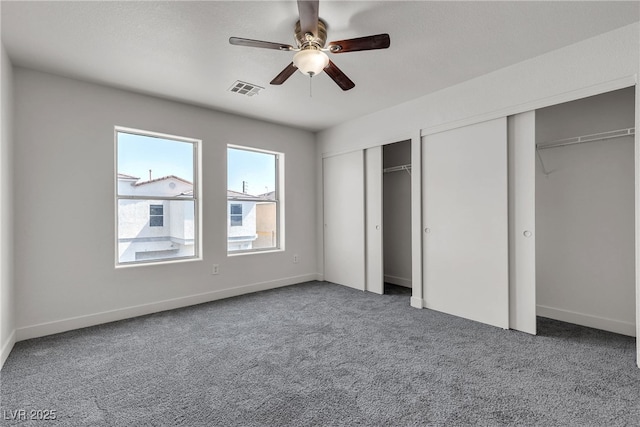 6117 Daisy Lee Ave, Las Vegas, NV 89108 - unfurnished bedroom with two closets, carpet flooring, and baseboards