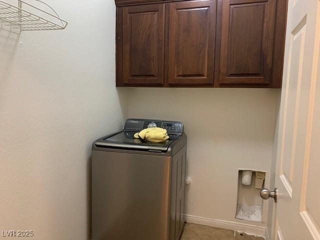 3728 Prairie Orchid Ave, North Las Vegas, NV 89081 - laundry room with washer / clothes dryer, cabinet space, and light tile patterned floors
