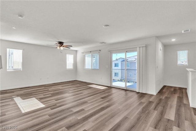 6952 Crescent Gold St, North Las Vegas, NV 89086 - unfurnished room with plenty of natural light, wood finished floors, baseboards, a ceiling fan, and recessed lighting
