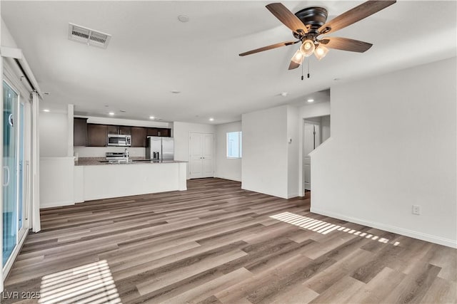 6952 Crescent Gold St, North Las Vegas, NV 89086 - unfurnished living room featuring recessed lighting, wood finished floors, and a ceiling fan