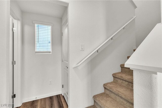 6952 Crescent Gold St, North Las Vegas, NV 89086 - stairs with wood finished floors and baseboards