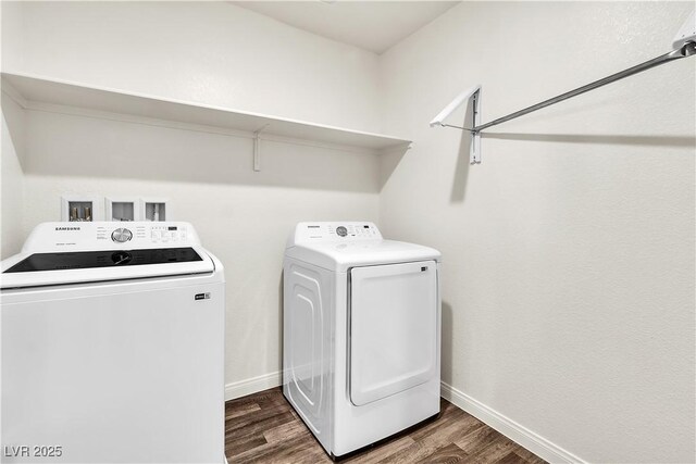 6952 Crescent Gold St, North Las Vegas, NV 89086 - washroom with washer and clothes dryer, dark wood finished floors, and baseboards