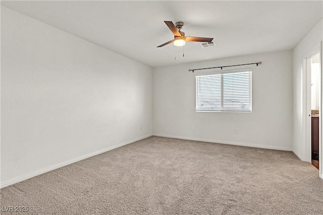 6952 Crescent Gold St, North Las Vegas, NV 89086 - empty room with light carpet, a ceiling fan, and baseboards