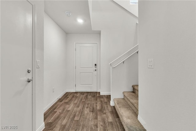 6952 Crescent Gold St, North Las Vegas, NV 89086 - entrance foyer with dark wood-style flooring, stairs, and baseboards