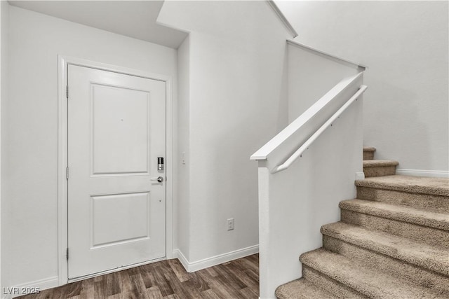 6952 Crescent Gold St, North Las Vegas, NV 89086 - foyer entrance featuring wood finished floors, stairs, and baseboards